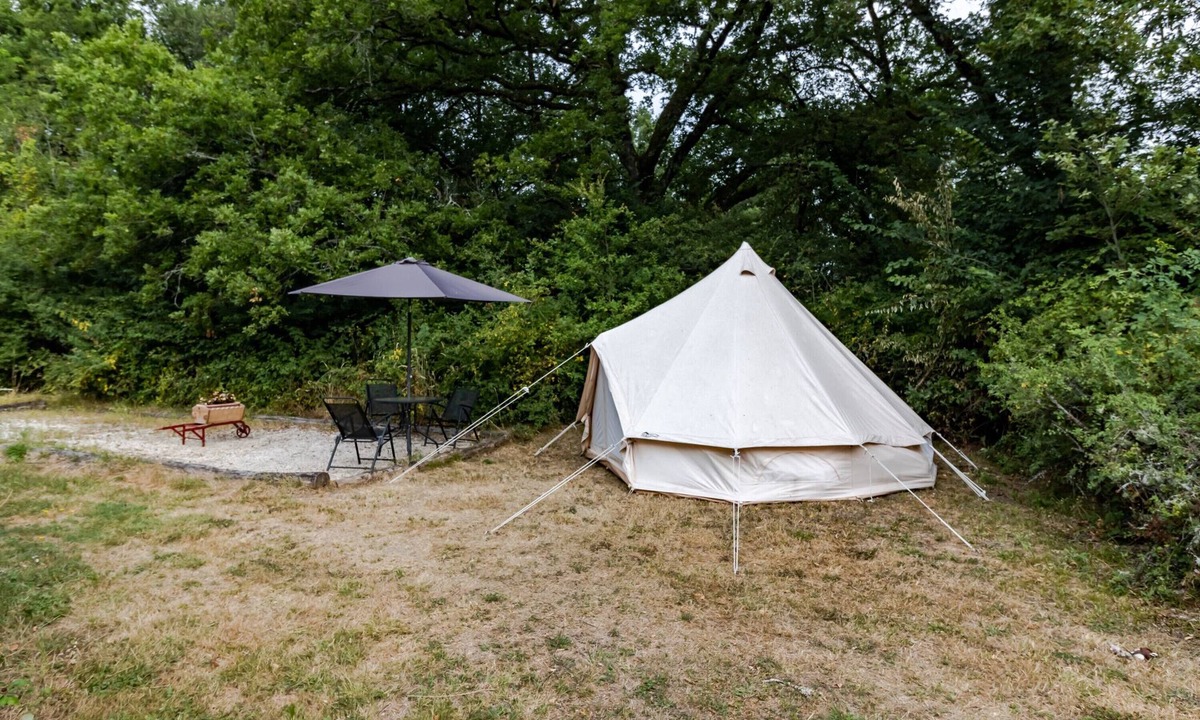 Auriac-du-Perigord RV Rental | Eco-Chic Glamping Tent with Natural Pool at Le Domaine de la Salamandre