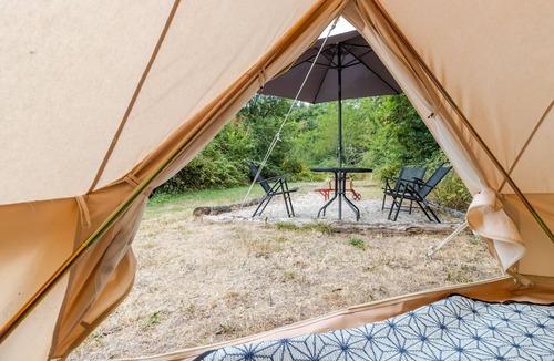 Auriac-du-Perigord RV Rental | Eco-Chic Glamping Tent with Natural Pool at Le Domaine de la Salamandre