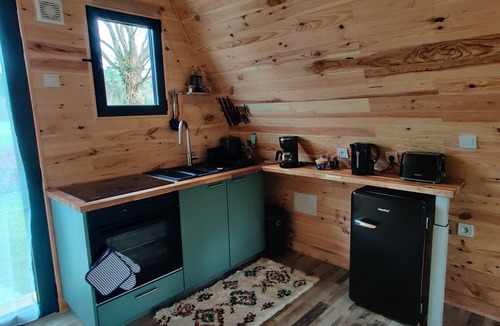 Vivy Ski Chalet | Enjoy the sounds of nature when you stay in this unique wooden Tipi.