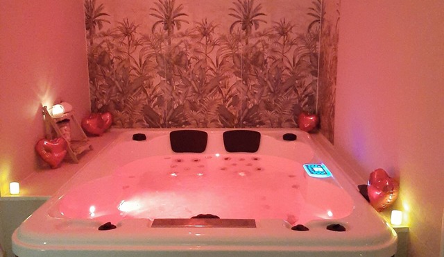 Private "love room" with a jacuzzi and massage table