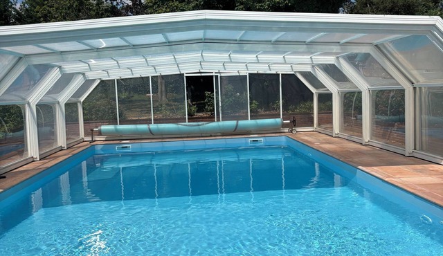 Vacation rental with a large pool and an outdoor hot tub. A quiet, wooded hamlet.