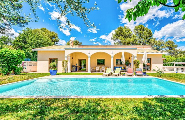 Welcome to this charming vacation home with pool and private tennis court.